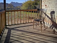 The chair sits peacefully with a grand view, witness to the tragedies of flood, Indian attacks, and disease.  Harsh pioneer life in Grafton, UT.