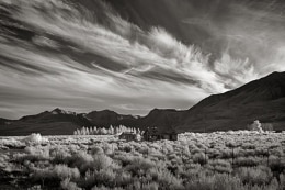 Abandoned cabin with a view of Mono Lake.  Clouds sweep in from the Sierra just at sunset to highlight the sagebrush before winking out.  Just south of Lee Vining, CA on Highway 395.